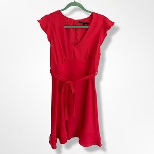 Coral Dress with flutter sleeve and hem. Size M